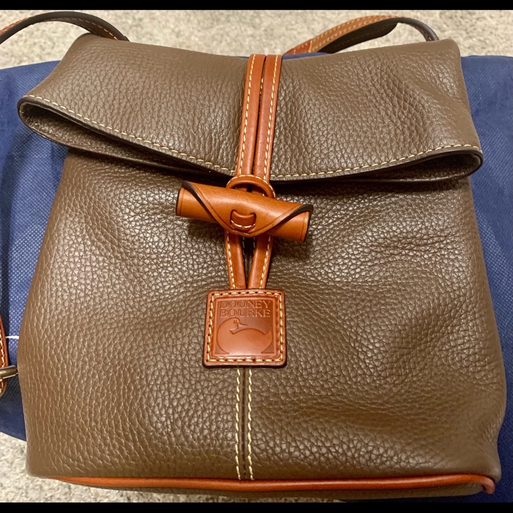 Dooney & Burke Crossbody. New without tags.  Adjustable strap.  Back zipper.